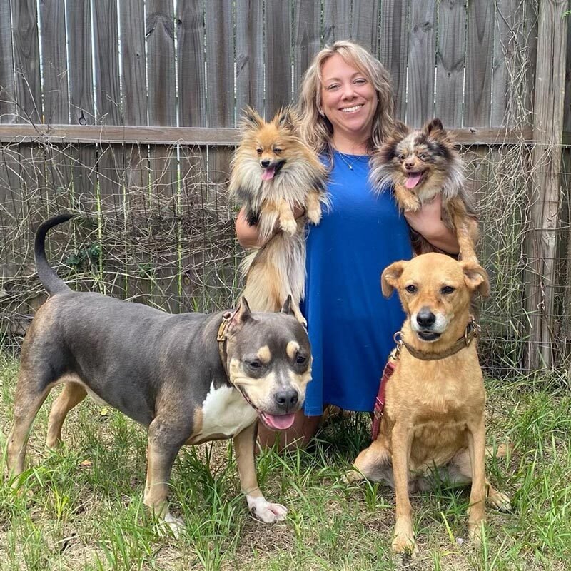 Woman With Four Dogs